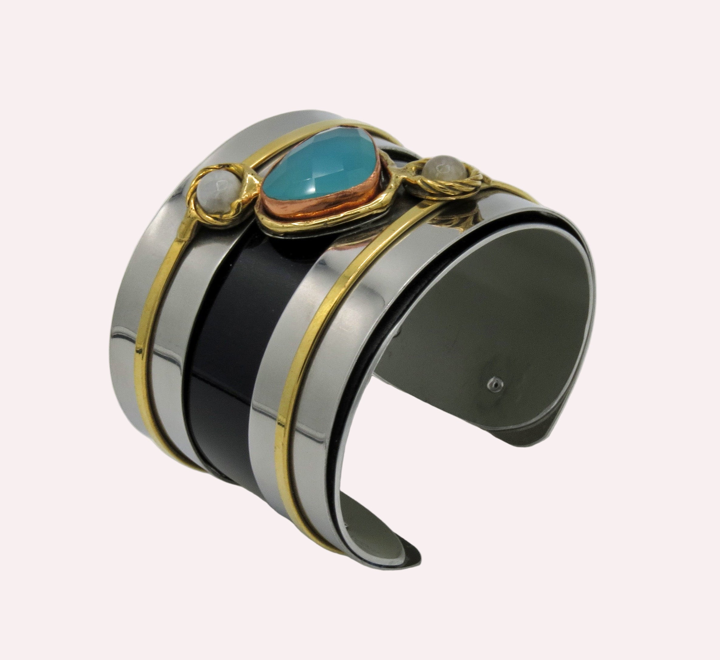 Multicolored cuff bracelet with turquoise stone on a white background