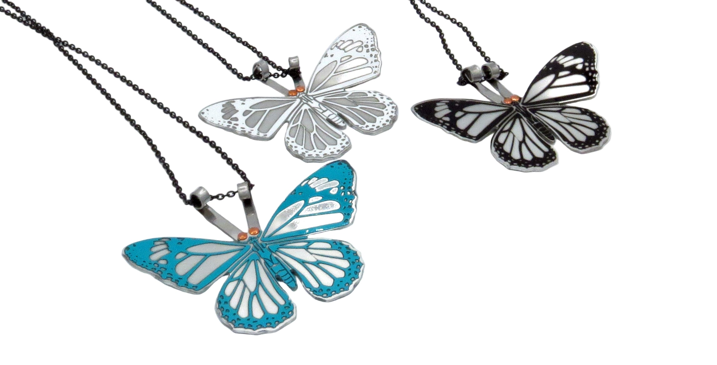 Butterfly-shaped necklaces on a white background