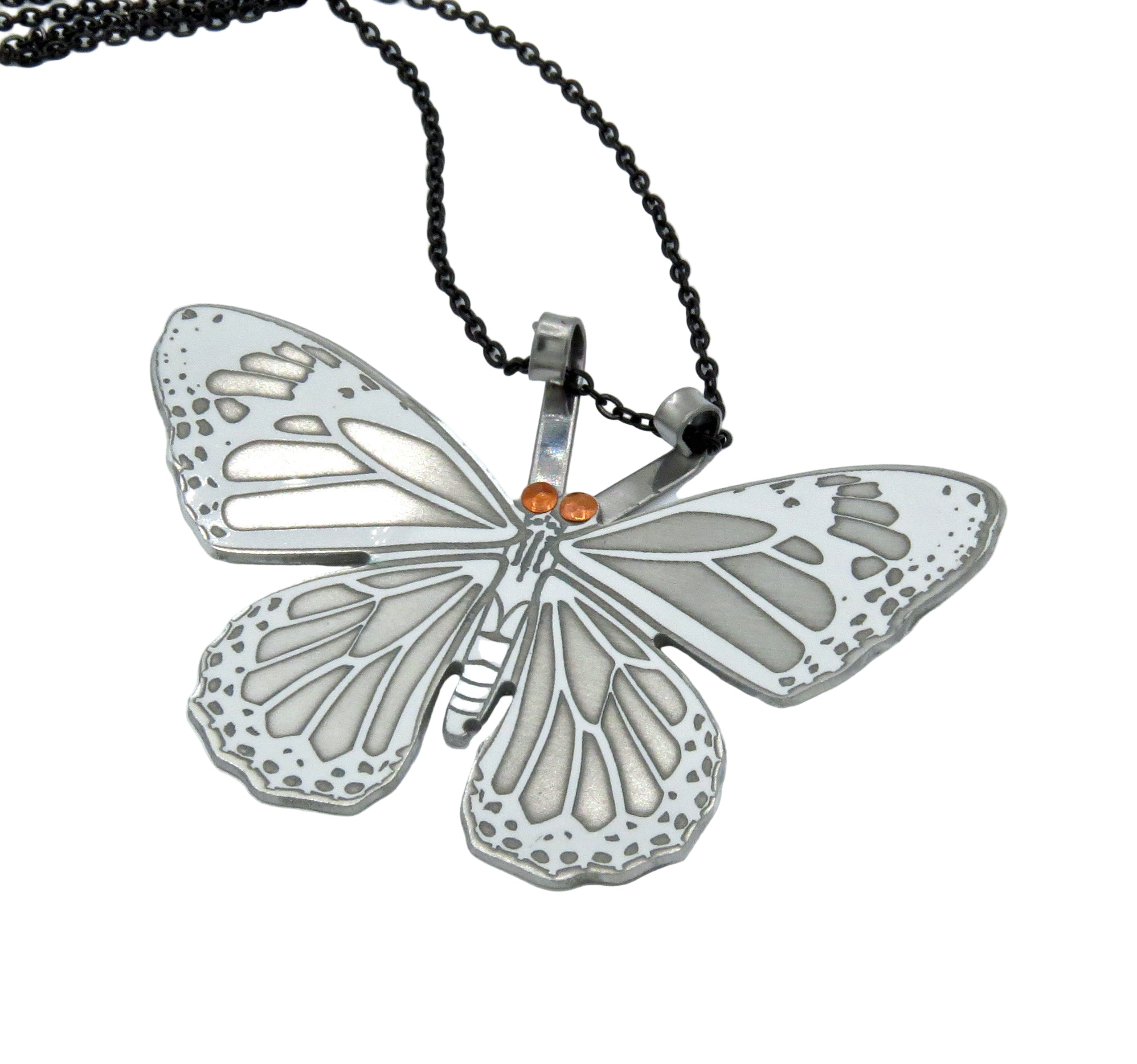 Butterfly-shaped pendant on a chain against a white background