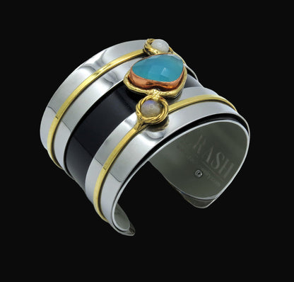 Multicolored cuff bracelet with gemstones on a white background