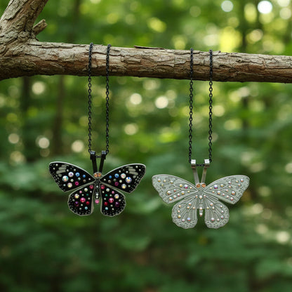 Butterfly-shaped pendants hanging from a branch with a forest background